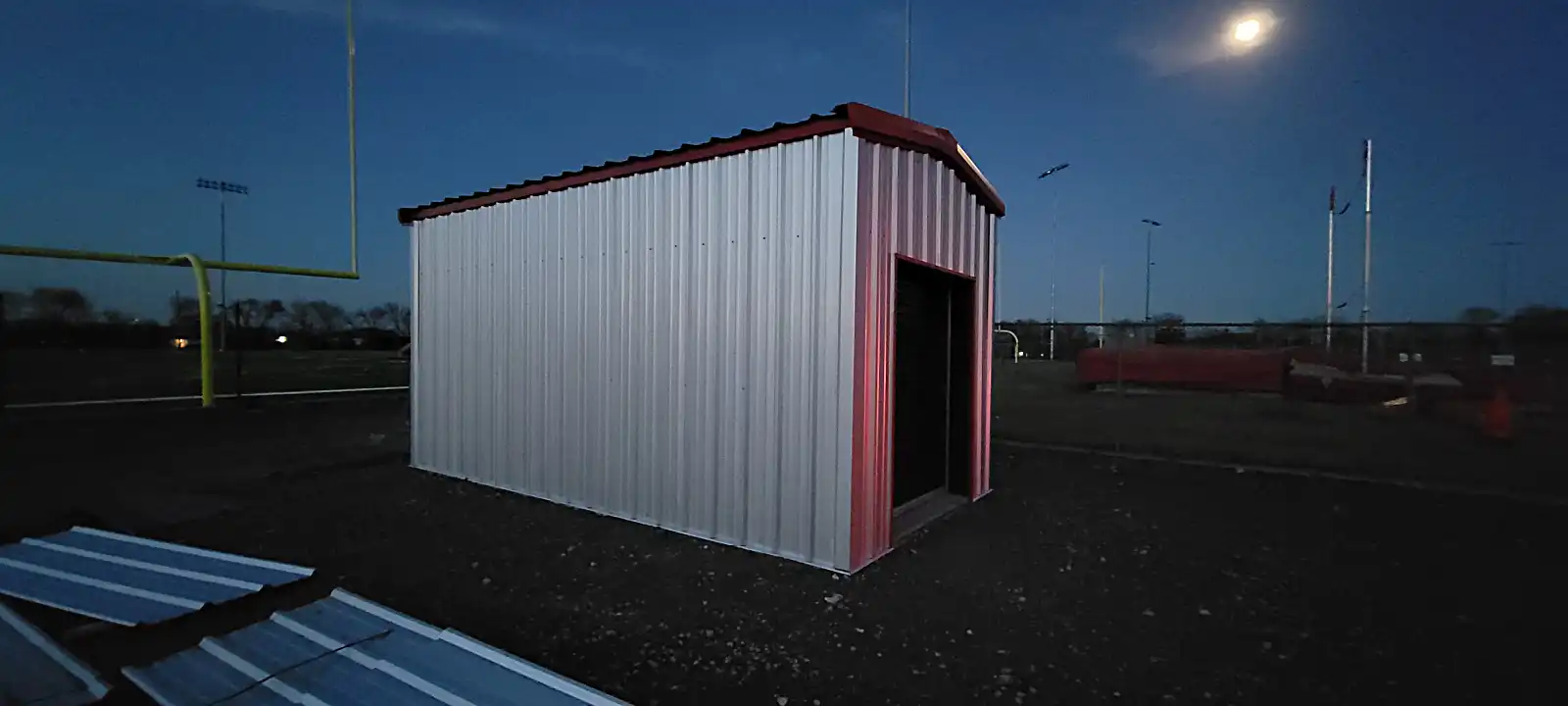 Final view of completed athletics field storage building