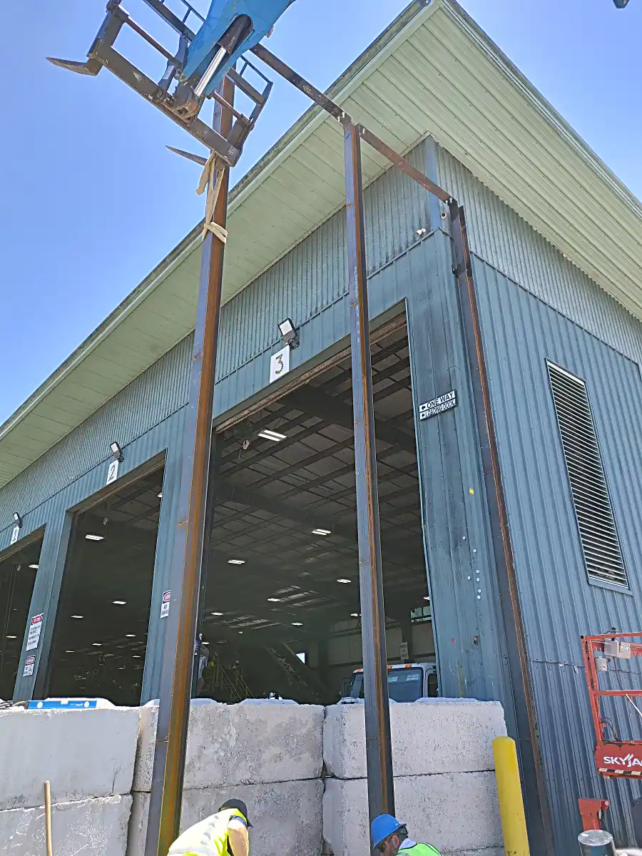 Initial posts set for tall metal security fencing