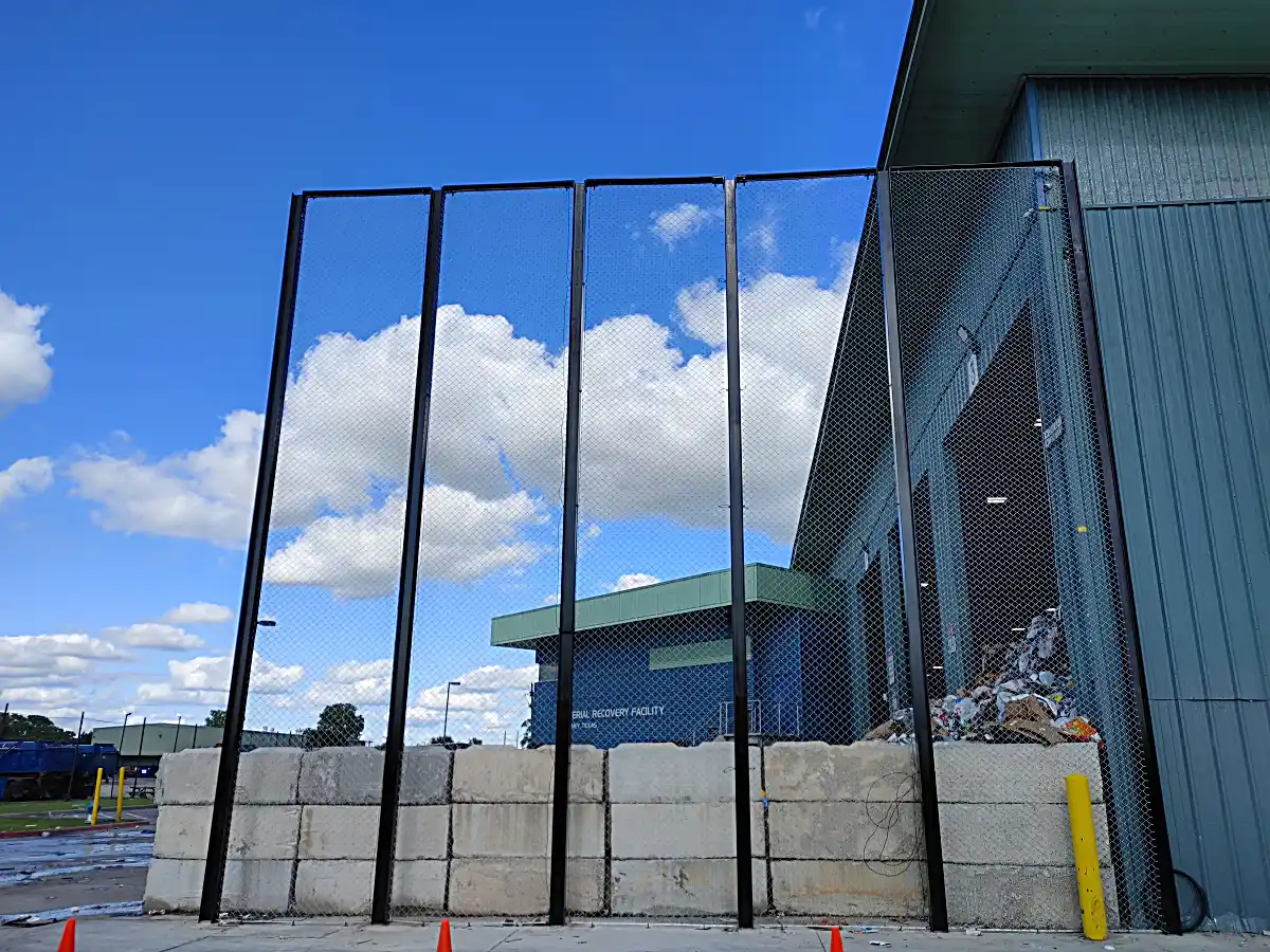 Completed section of tall metal security fencing