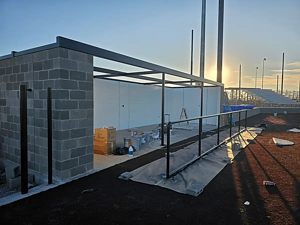 Looking out from beneath steel dugout awning