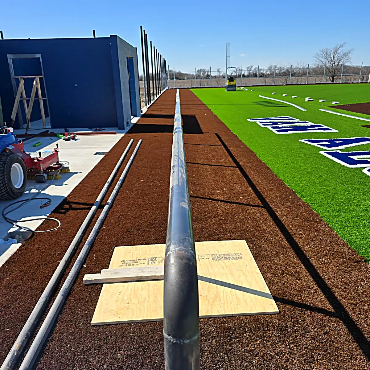 Steel safety bollards installed near dugouts
