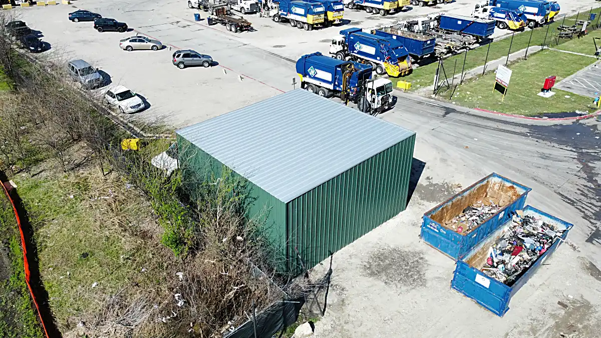 Roofing and wall panels being attached to frame