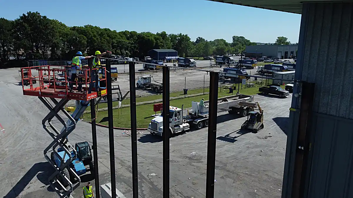 Aerial view of fence layout alongside existing building