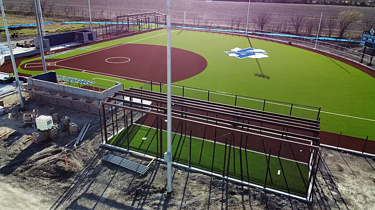 Drone tracking shot of baseball dugouts